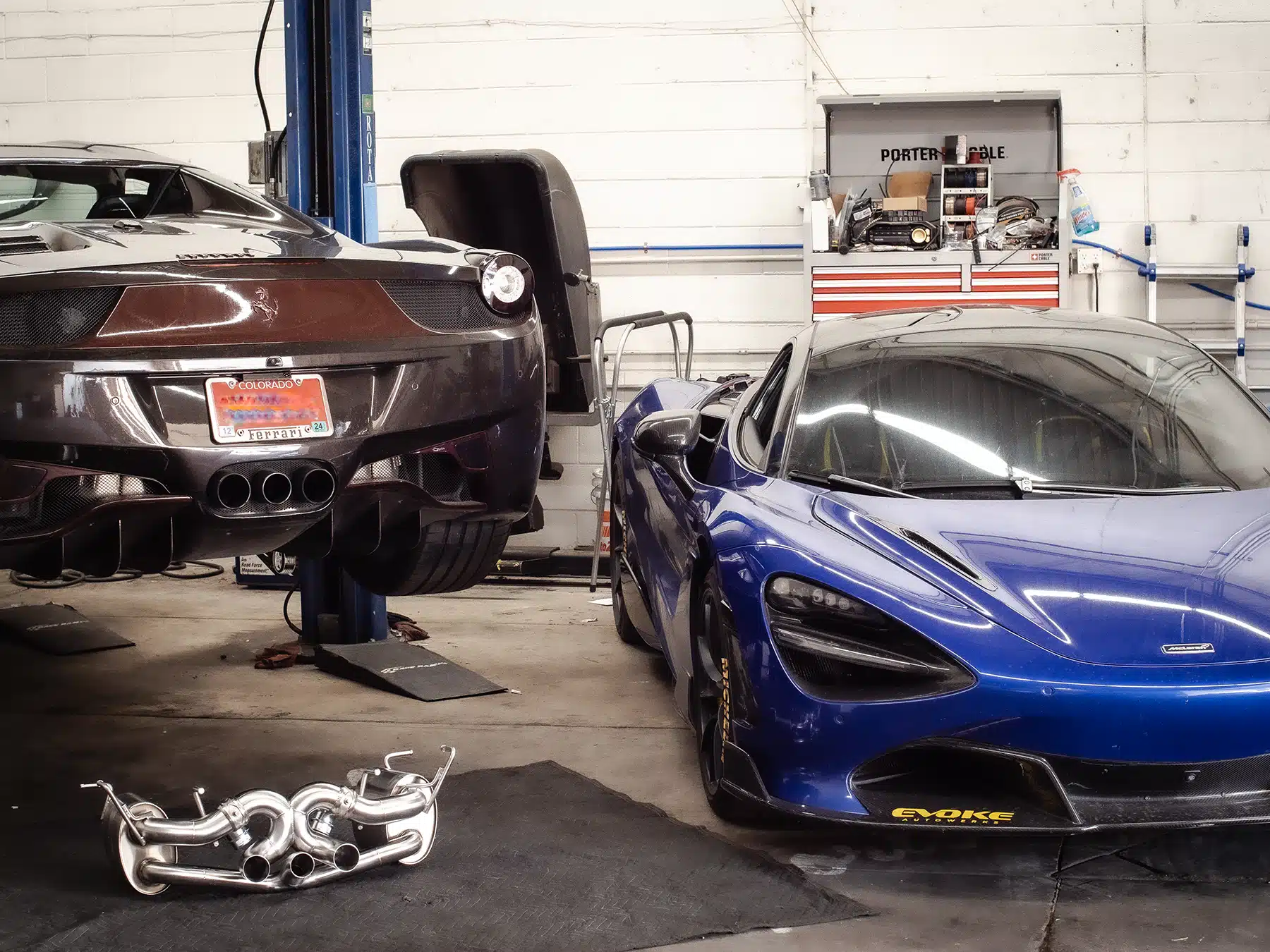 Inside of Evoke Autowerks shop with McLaren and Ferrari.